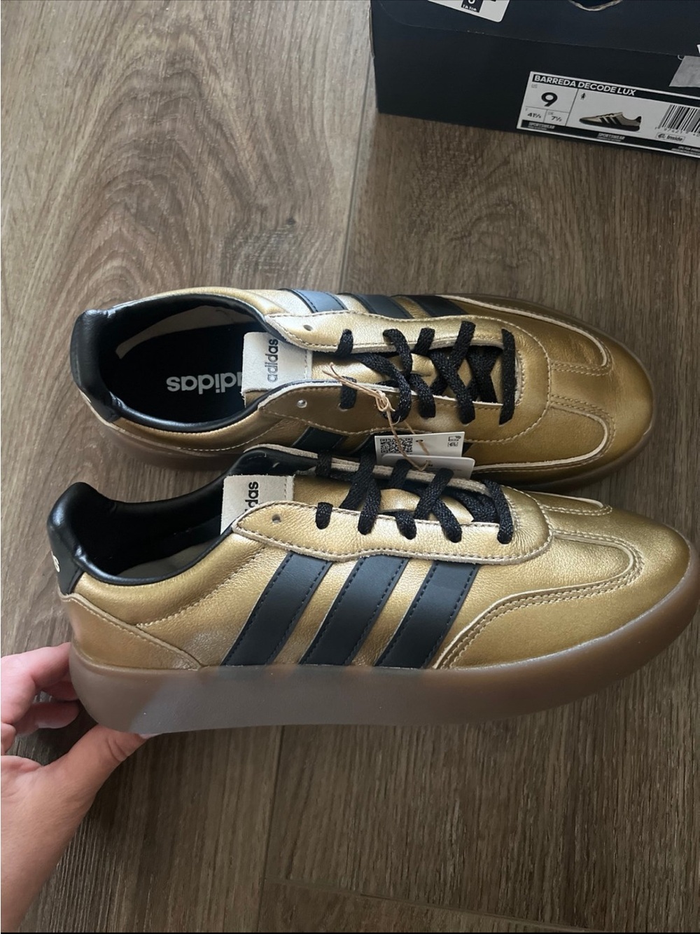 Adidas woman’s Gold Samba-Inspired Sneakers with Black Stripes